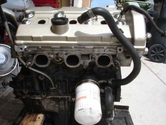 Engine with oil filter and hoses attached
