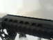 1985 Ford Bronco - Close-up of a black rifle handguard a rail system for accessories.