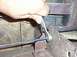 This is the easiest way to remove e-brake cable sheaths: slide a 1/2" box-end wrench over the e...