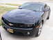 1993 Ford C-150 (Centurion Conversions) - Front view of a black Chevrolet Camaro, an LSU Tigers license plate and RS badging.