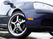 2007 Volkswagen Rabbit - This car has aftermarket wheels and an orange turn signal on the front fender.