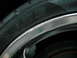 2007 Volkswagen Rabbit - A close-up shows tire sidewall markings and a damaged alloy wheel rim.