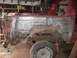 1978 Ford Bronco - Vehicle undergoing repair, focusing on the heavily rusted rear quarter panel and wheel well area.