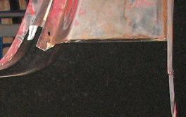 Red and black vehicle panel detail, close-up