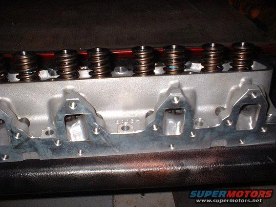 Engine cylinder head with valve springs visible