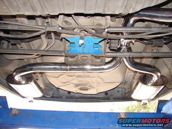Dual exhaust mufflers and pipes under a vehicle