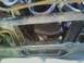 1994 Ford F-250 - This photo shows the underside of a vehicle, focusing on the engine oil pan and frame components.