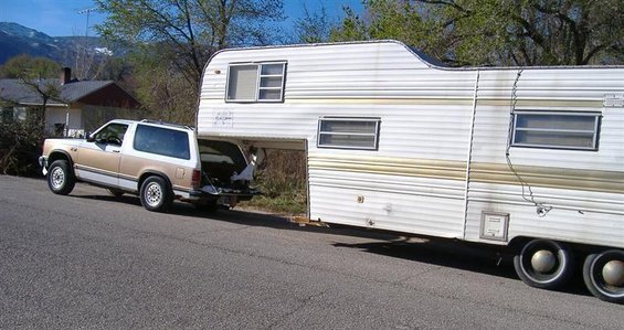 5thwheel1.jpg Wouldn't you love to see how the trip went? Good chance he ended up doing some unintended off roading somewhere.  Check the 'hills' in the background.  How would you like to meet this rig on a two-lane road...coming down the mountain in your direction?
She's hitched up and ready to roll!! Amazing how the extra weight  smoothes out the ride.   
Needed to air up the rear tires a bit (about 160 psi).