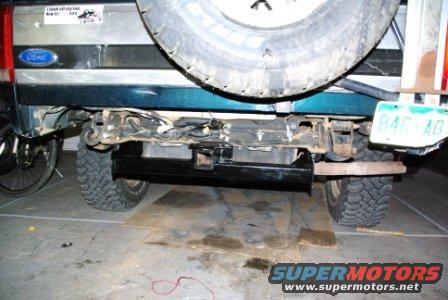 Rear view of a 1995 Ford Bronco with a hitch receiver and spare tire mounted externally