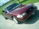 2004 Ford Crown Victoria - Maroon 2004 Ford Crown Victoria seen from a 3/4 front angle.