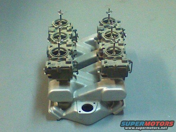 Dual quad intake manifold with carburetors, silver, top-down view