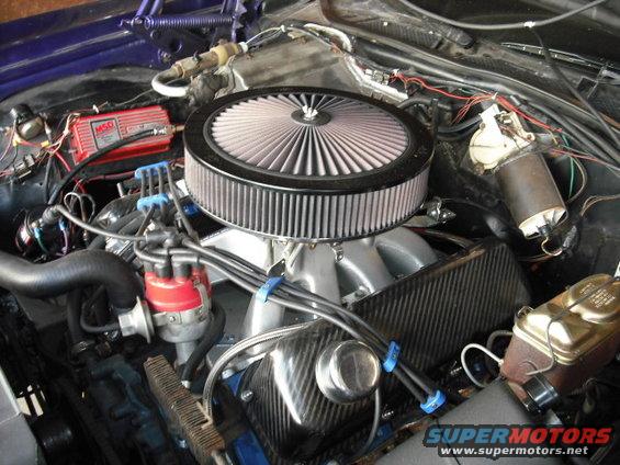 Engine bay with large air filter, red MSD ignition box, and chrome brake fluid reservoir