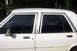 1991 Ford Crown Victoria LTD - Side view of a white 1991 Ford Crown Victoria LTD with tinted windows and chrome accents.