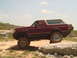 1992 Ford Bronco - This 1992 Ford Bronco is navigating a rocky trail under a partly cloudy sky.