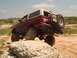 1992 Ford Bronco - This 1992 Ford Bronco is shown off-roading, demonstrating its capability on rough terrain.