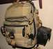 1984 Ford Bronco - Tactical backpack with multiple compartments and attachment points, including a side pouch.