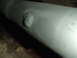 1996 Ford Bronco - Close-up view of a patched exhaust pipe, likely from the undercarriage of a vehicle.