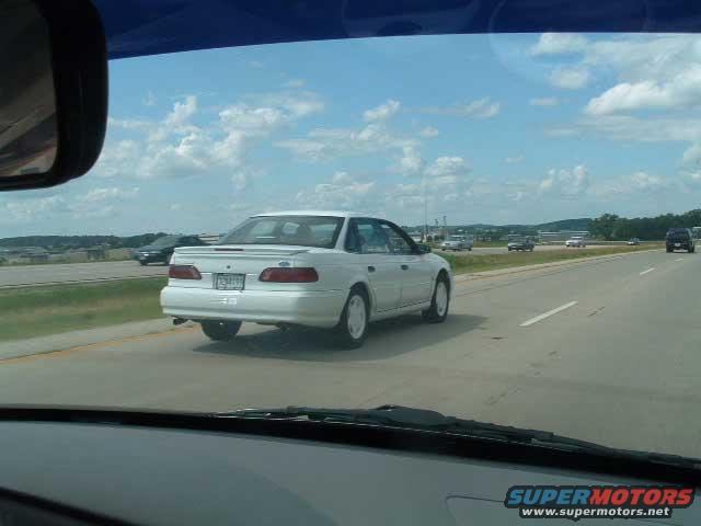 1993 Ford Taurus driving on highway, seen from another car