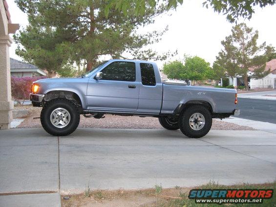 Light blue 1990 Toyota Pickup SR5 extended cab, side view