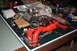 2001 Subaru Legacy - A disassembled engine component, likely a supercharger and intake manifold, is laid out on a workbench.