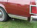1984 Mercury Grand Marquis - Rear view of a 1984 Mercury Grand Marquis LS showing the taillight, chrome trim, and exhaust pipe.