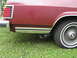 1984 Mercury Grand Marquis - Rear view of a 1984 Mercury Grand Marquis showing the taillight, chrome trim, and wheel.