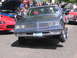 2001 Chevrolet Silverado 1500 - Customized 1980s Oldsmobile Cutlass Supreme on display with other vehicles.
