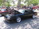 2001 Chevrolet Silverado 1500 - Black coupe with hood open at a car show, chrome wheels visible.