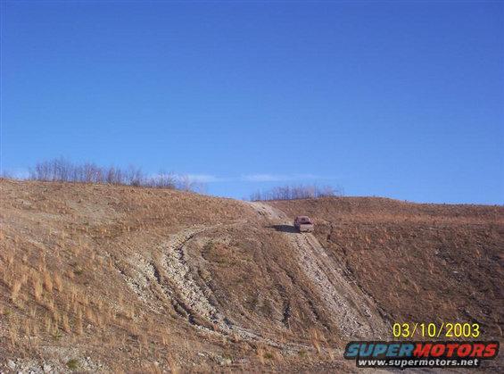 Picture 2 of 4 of me climbing a hill on an old strip mine near where I live. This hill is kind of steep but it really isn't all that bad compared to some of the other spots here.