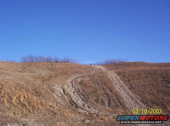 Picture 3 of 4 of me climbing a hill on an old strip mine near where I live. I'm the black dot next to my truck. I'm about 6'1 so that kind of gives you an idea of how faw away the pictures are taken from. Incase your wondering, I have a buddy down there takin the pictures for me.