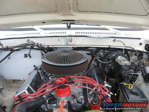 Engine bay showing chrome valve covers, red MSD spark plug wires, and a large circular air filter