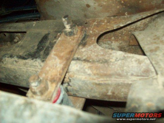 close-up of rusty truck frame with suspension components