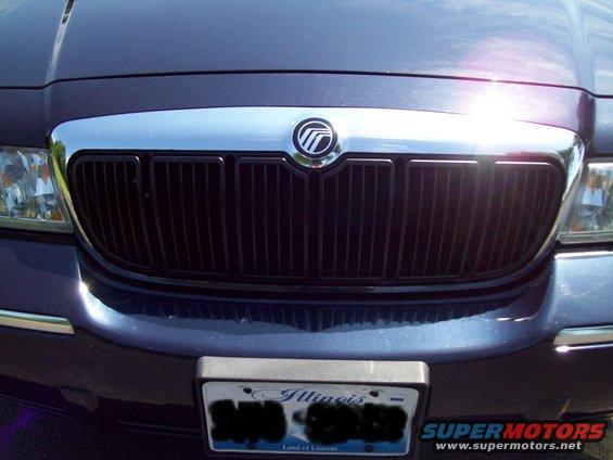 Dark blue Mercury Grand Marquis front grille with chrome trim and a Mercury emblem