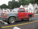 1992 Ford Ranger - This pickup truck has a red cab and bed with a gray front end.