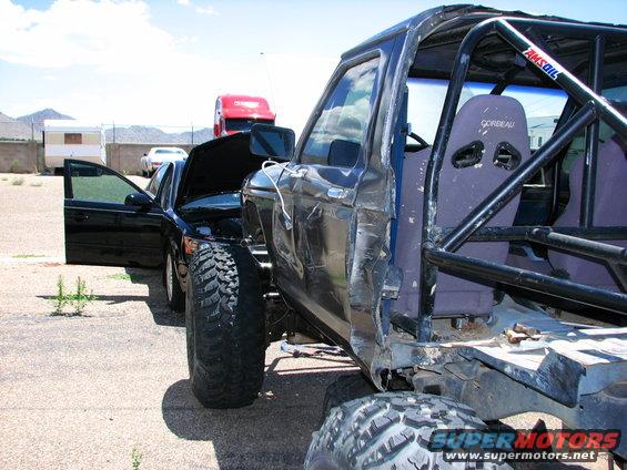 Modified SUV interior with roll cage and racing seats, door open