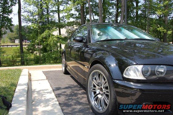 Black 2002 BMW M3 coupe parked curbside
