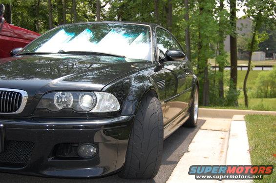 Black 2002 BMW M3 parked, front 3/4 view showing wide tire