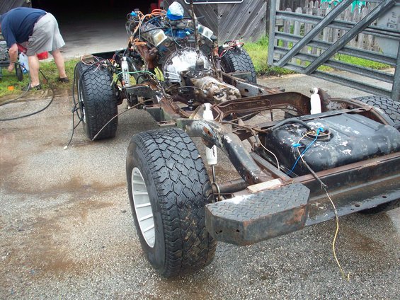 1978 Jeep CJ5 chassis with engine and drivetrain, 3q-front view
