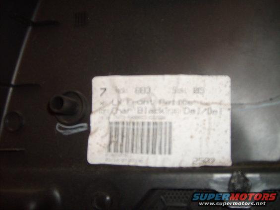 Door panel part with label showing 'Char Black'