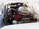 1956 Ford Fairlane - The engine compartment of a classic car, a prominent V8 engine and the 'Thunderbird' branding.