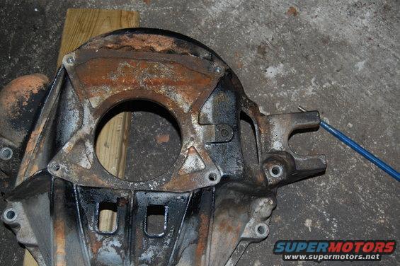 Rusted metal part with blue cable