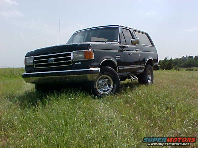 Black 1989 Ford Bronco 4x4 in a field