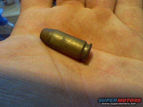 When I pulled the front passenger seat for the trans swap, I found this under the vinyl flooring.  Someone must've been reloading in a hurry...
