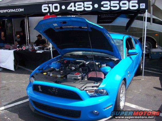 Blue 2007 Ford Mustang with hood open, showing engine and front grille