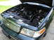 1999 Ford Crown Victoria - Engine bay of a 1999 Ford Crown Victoria, showing the V8 engine and aftermarket air intake system.