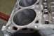 1996 Ford Bronco - Close-up view of the cylinders within an engine block, revealing internal wear patterns.
