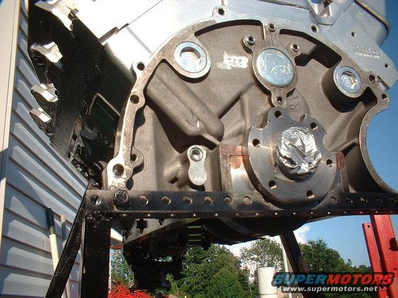 Engine block on stand, close-up of rear main seal area