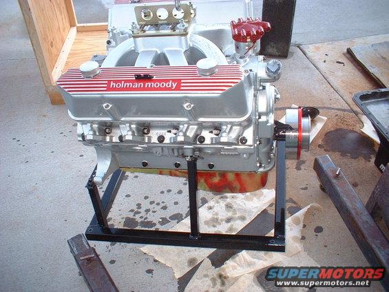 Holman Moody V8 engine on stand, silver with red stripes on valve covers