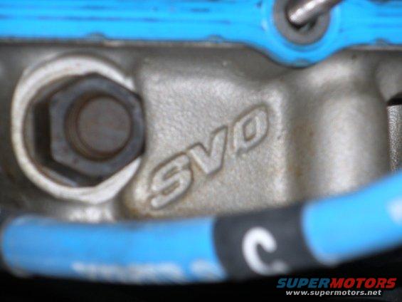 Engine part with SVO marking and blue gasket