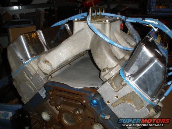 Engine block with chrome valve covers and aluminum intake manifold, blue spark plug wires